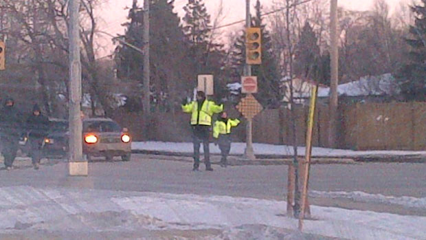 Cadets direct traffic at McPhillips Street and Kingsbury Avenue after a power outage on Sunday.